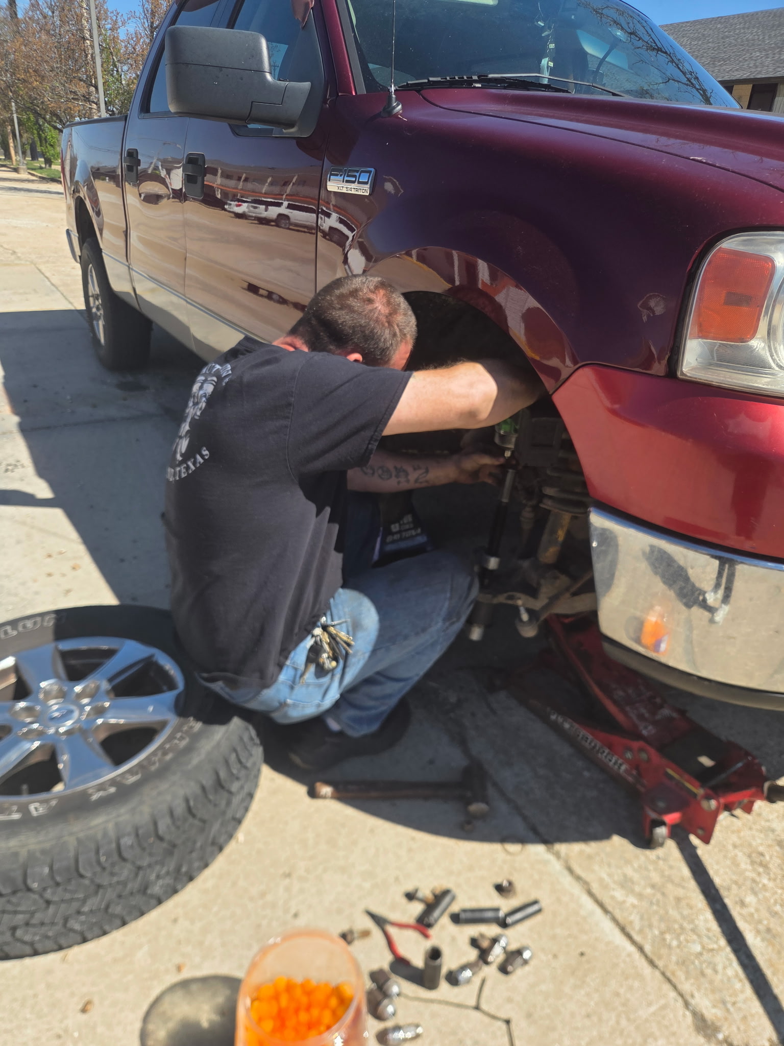 Mechanic working on truck wheel well